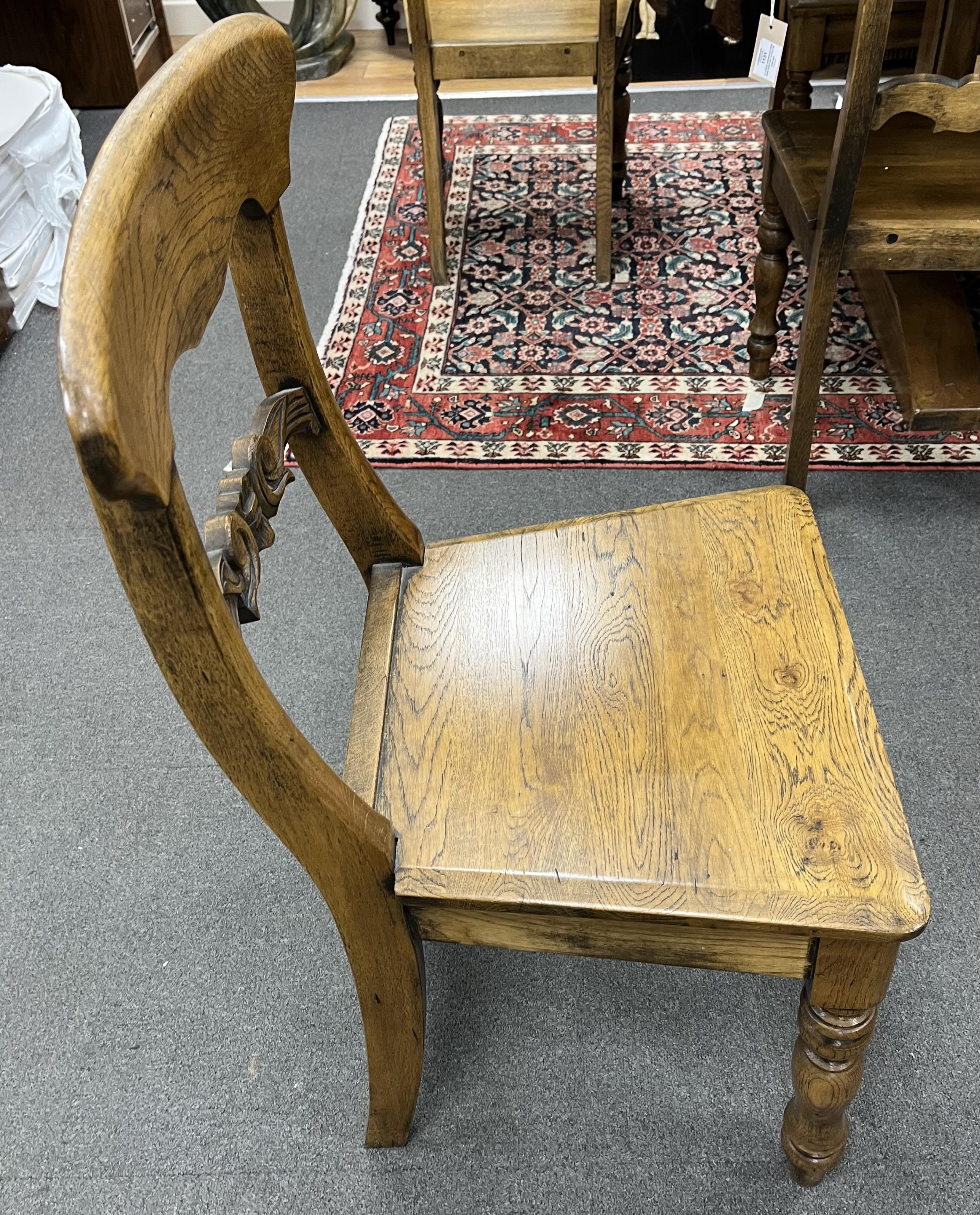A set of twelve reproduction Victorian style oak wood seat dining chairs, width 47cm, depth 39cm, height 88cm. Condition - good